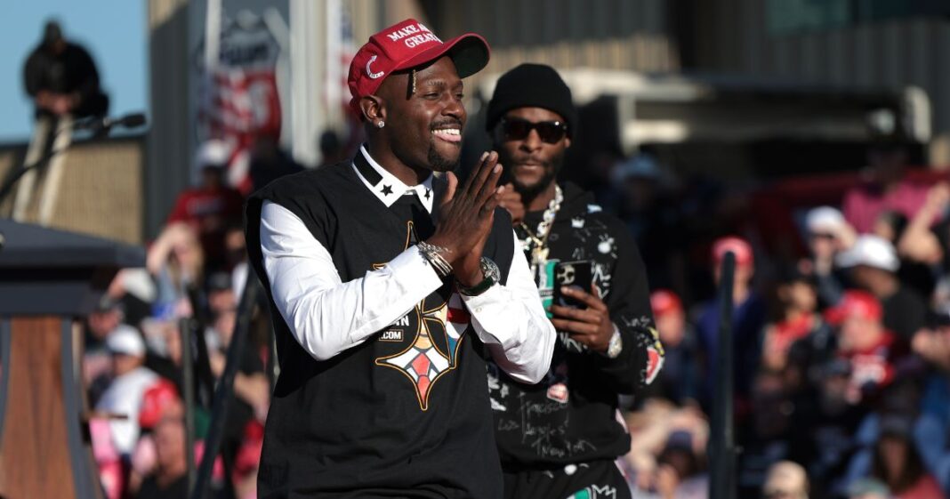 Former Pittsburgh Steelers players Antonio Brown (L) and Le'Veon Bell (R) leave the stage after Brown spoke in support of Republican presidential nominee, former U.S. President Donald Trump, during a campaign rally on October 19, 2024, in Latrobe, Pennsylvania.